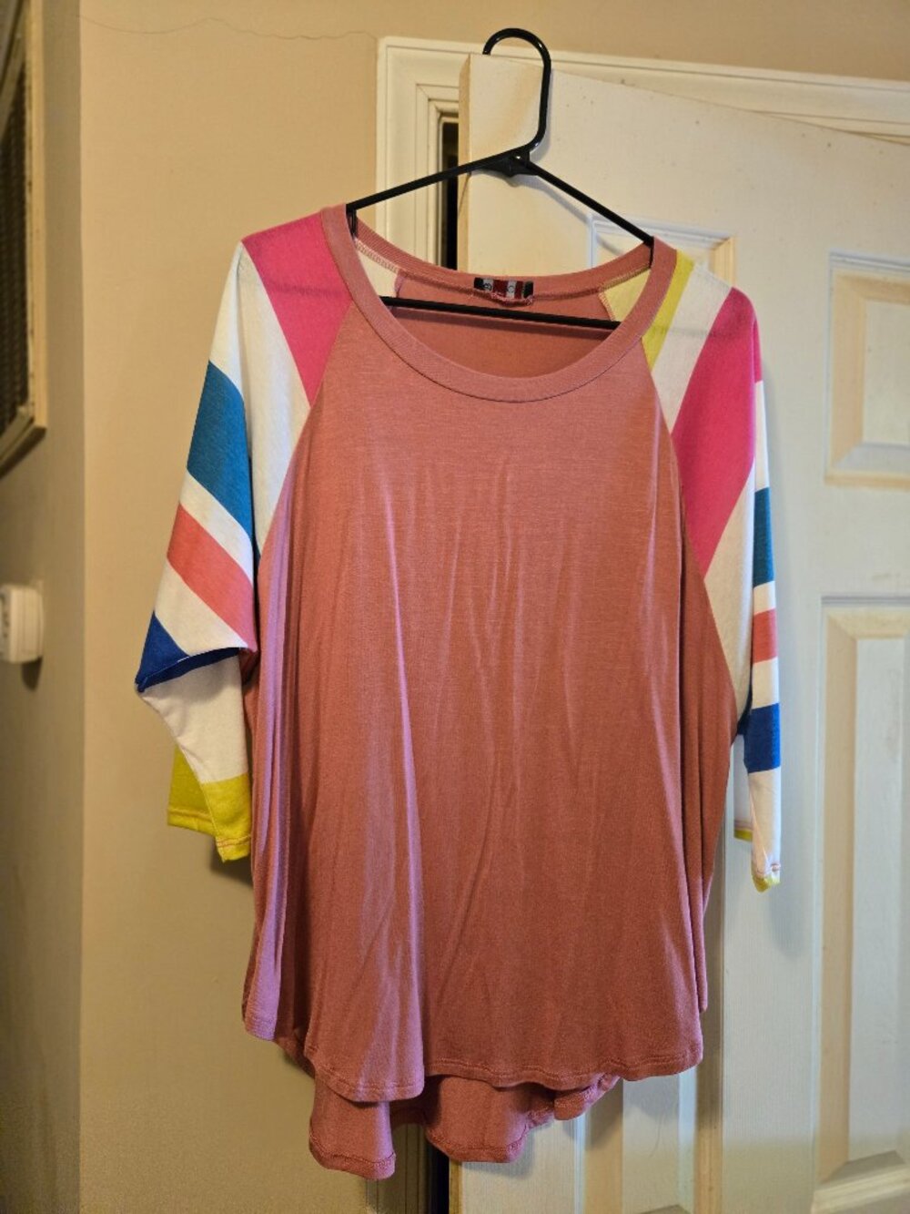 Vision M, oversized baseball style top in hues of pink, white, & blue